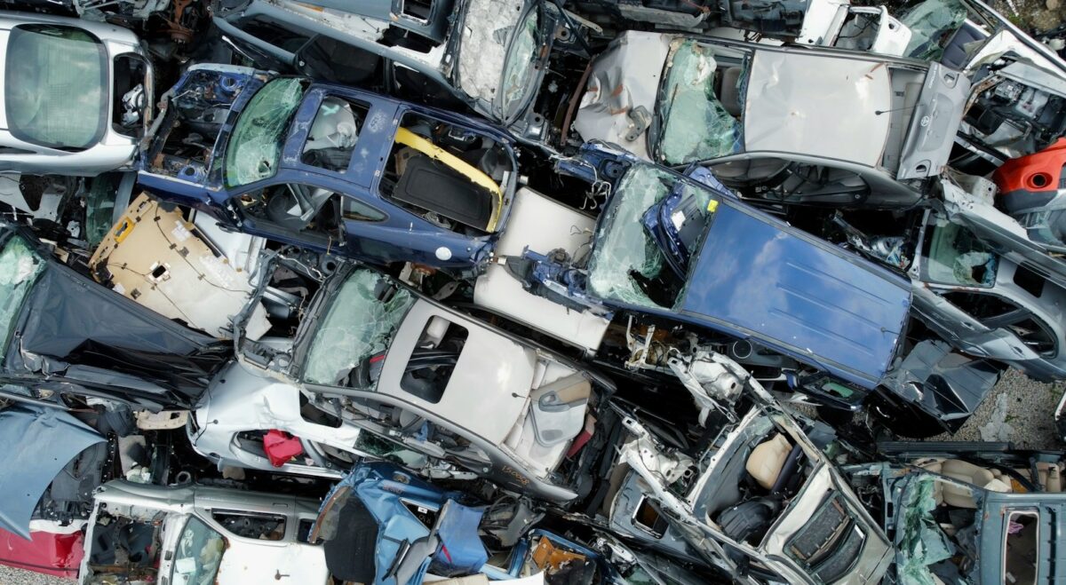 Pile of crushed and wrecked cars at junkyard